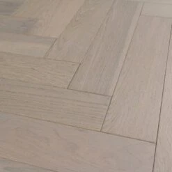 Liberty Floors Pebble Grey Oak - Herringbone Parquet 14mm Engineered Real Wood Flooring (219386) -Floor Shop pebble grey oak herringbone parquet 14mm engineered real wood flooring 219386 p85834 201394 image
